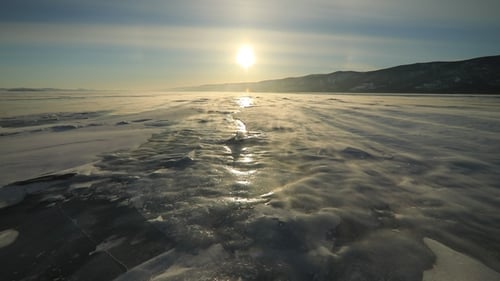 Winter Baikal. Strong Wind on the Ice, Drifting Snow.