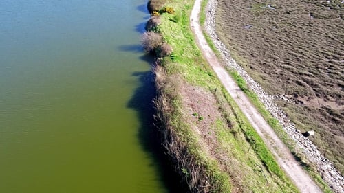Flying Over the Tideland and Lake in Conwy Area in North Wales
