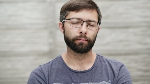 Portrait of a Thirty-five Year Old Man with a Beard Wearing Glasses