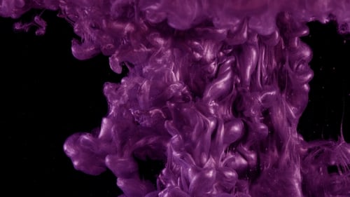 Ink in Water. Colour Pink Glitter Paint Reacting in Water Creating Abstract Cloud Formations