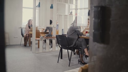 Amazing Dolly Shot of Creative Multiethnic Team Brainstorming at Modern Office Meeting. View Through