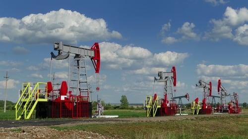 Working Oil Pumps in Row at Sunny Day