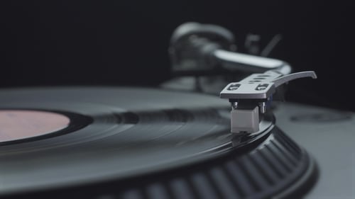 Record Player Needle on Spinning Vinyl Record