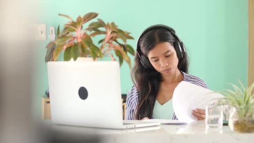 Young Woman Working at Laptop from Home Office