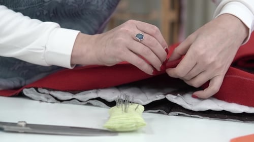 Girl Designer Clothes Pins Needles with a Fabric for Shaping. Seamstress Works