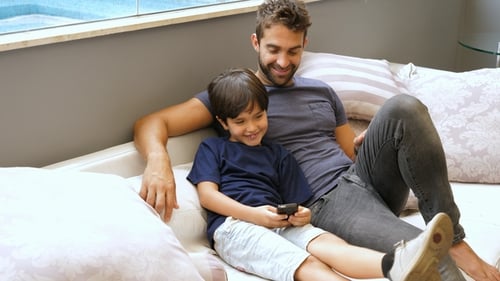 Father and Son Relaxing on the Couch