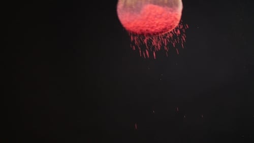 Make-up Brush with Pink Powder on Black Background