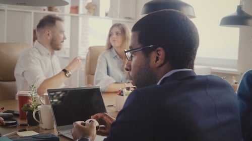 Group of Professionals in a Workplace Meeting