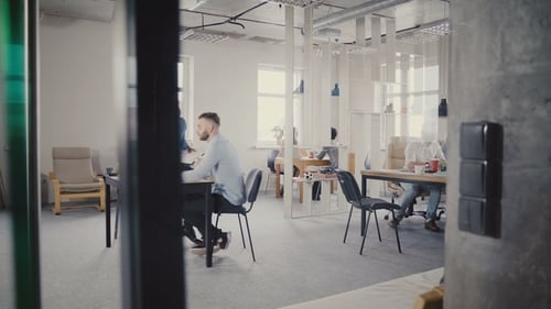 Dolly Shot of Happy Mixed Ethnicity Office Colleagues Enjoying Working at Healthy Office. View