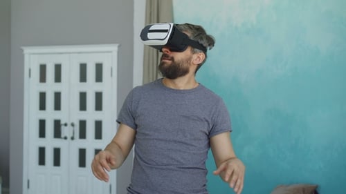 Man Using VR Headset in a Home Setting