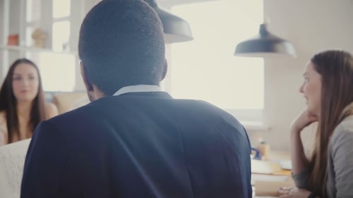 Multiethnic Business People Collaborate in Modern Loft Office. Young Happy Colleagues Smiling
