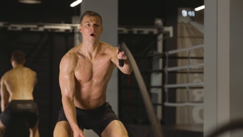 Man Working Out with Ropes