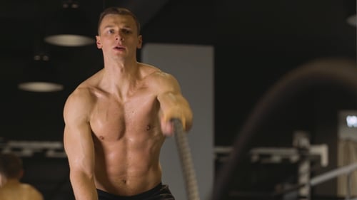 Man Working Out with Ropes