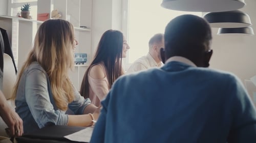 Teamwork at Modern Light Trendy Multiethnic Office Meeting