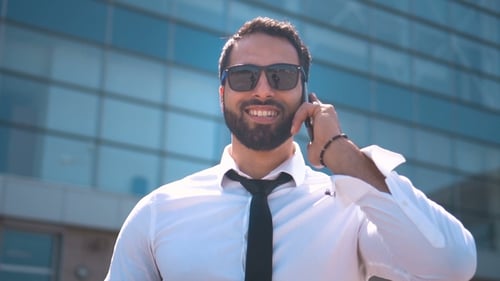 Businessman Talking By Smartphone