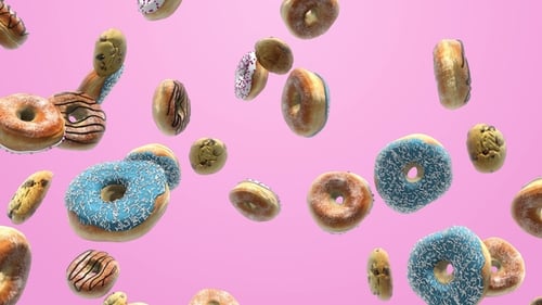 Sweet Donuts and Cookies Floating on Pink Background