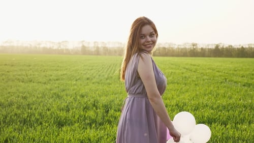 Cute Brunette Girl Walk on Spring Wheat Field