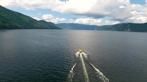 Aerial View of Teletskoye Lake and Yellow Boat in Motion