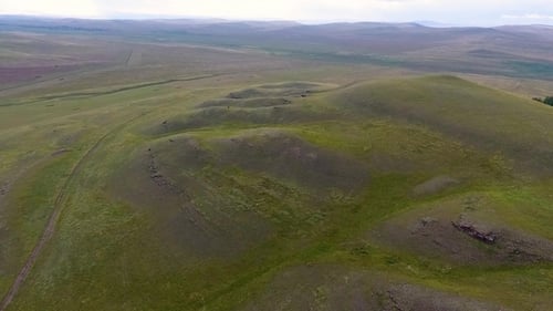Aerial View of the Endless Fields, Hills, Haystacks and the Sky before the Storm