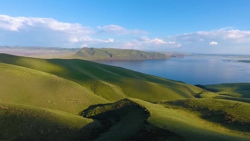 Aerial View of the Green Hills, Cloudy Sky and the Yenisei River
