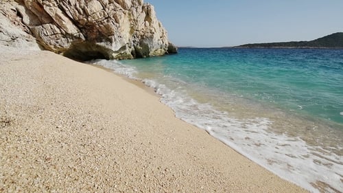 Beautiful Mediterranean Sea Coastline, Strong Waves Crashing in on Seashore with Foam on Yello