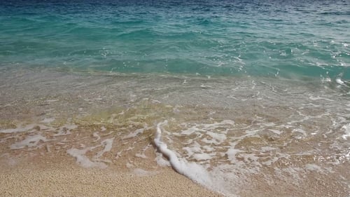 Beautiful Mediterranean Sea Coastline, Strong Waves Crashing in on Seashore with Foam on Yello