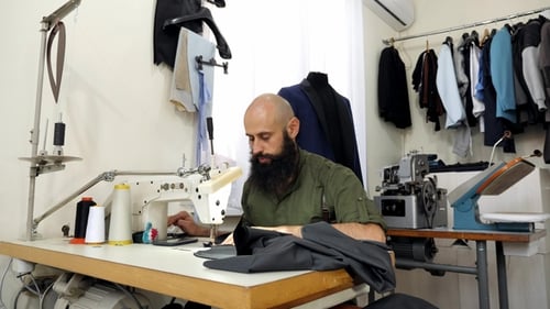 A Tailor in a Sewing Workshop at Work