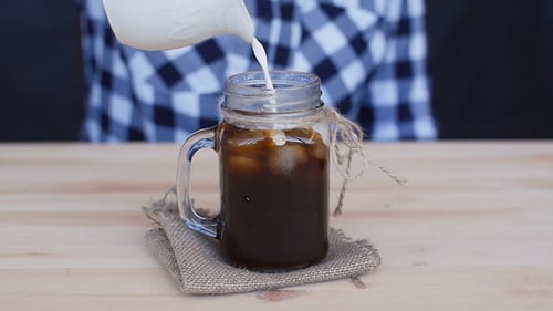 Cream Is Poured Into a Coffee Cocktail