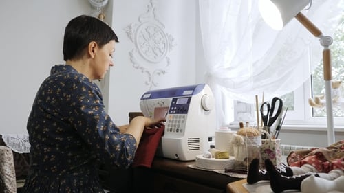 Camera Movement. Master of Handmade Made Clothes for Doll on Sewing Mashine