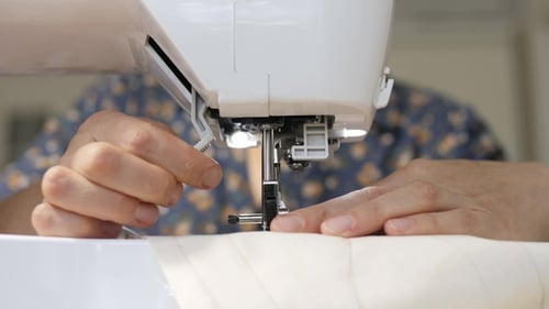 Seamstress at Work on a Sewing Machine