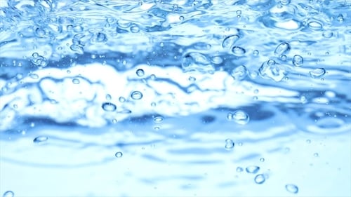 Ice Cubes Dropping Into Cool Blue Water