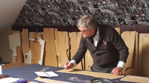 Mature Professional Tailor Taking Measurements for Sewing Suit at Tailors Shop. Man with Measuring