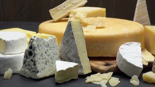 Various Delicious Cheeses Arranged on a Table