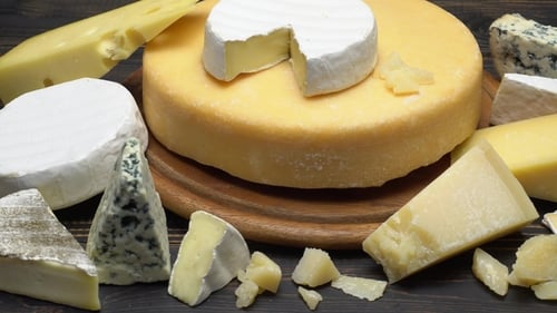 Delicious Cheese Assortment on Wooden Surface