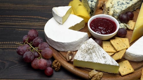 Delicious Cheese Board with Grapes and Crackers