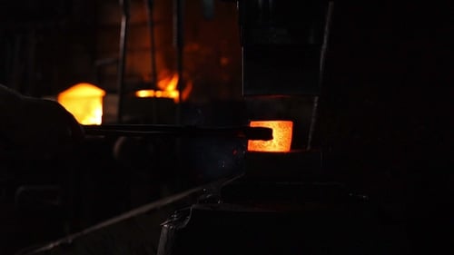 Forging Hot Metal Under a Mechanical Press in Workshop