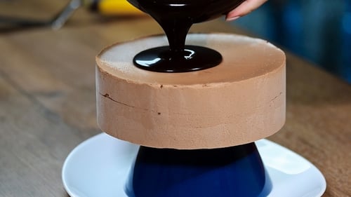 Chocolate Sauce Poured on Light Brown Cake