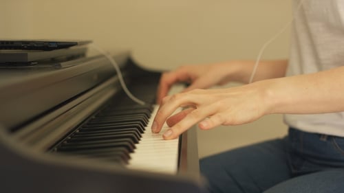 Person Playing Piano Close Up