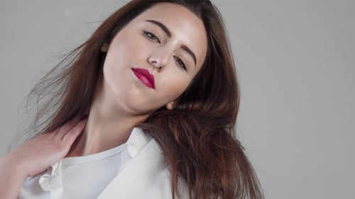 Portrait of Youn Woman Model in Studio with Blowing Hair