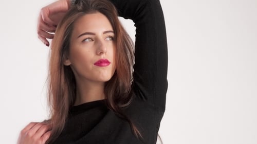 Attractive Brunette Posing in Studio for Fashion Shoot