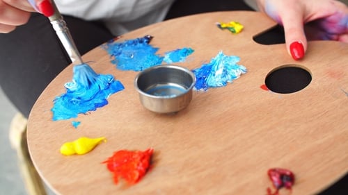 Artist Brush Mix Color Oil Painting on Palette .
