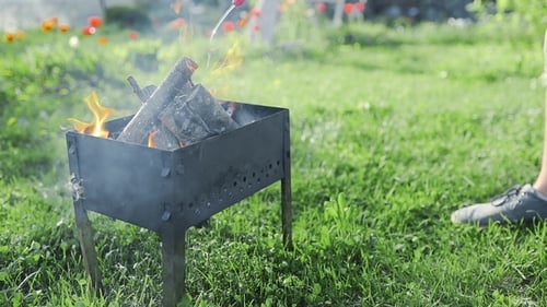 Man Adds Liquid Ignition To the Small Smoking Wood in the Grill and Flame Bursts Out, BBQ at the