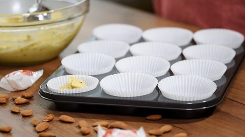 Filling the Cupcake Holders with the Cake Dough and a Spoon