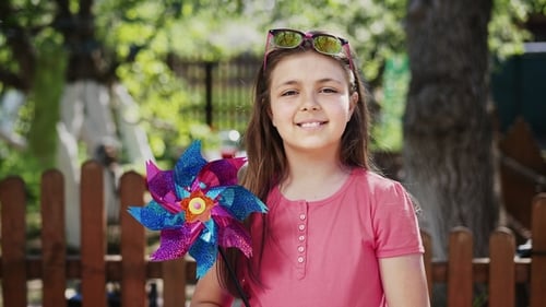 Pre-teen Girl with Windmill Toy