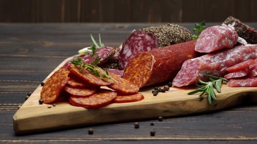 Assorted Salami and Cured Meats on Wooden Board