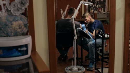 Tattoo Artist Creates Arm Tattoo in Studio