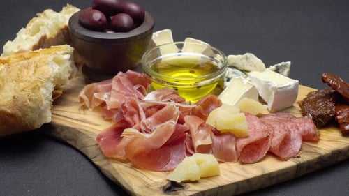 Appetizing Bread Cheese Meat Assortment on Wooden Board