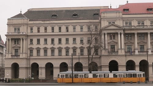 Moving Tram in City Budapest with Old Historical Building in Background, Hungary