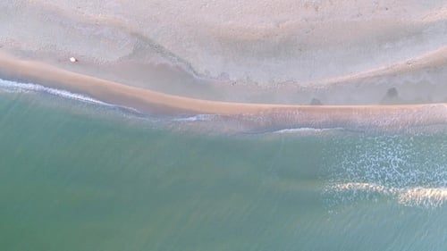 Woman Is Walking Narrow Beach Line, Waves and Ocean.