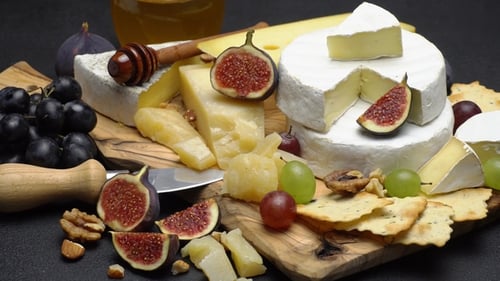 Elegant Cheese and Fruit Board Still Life